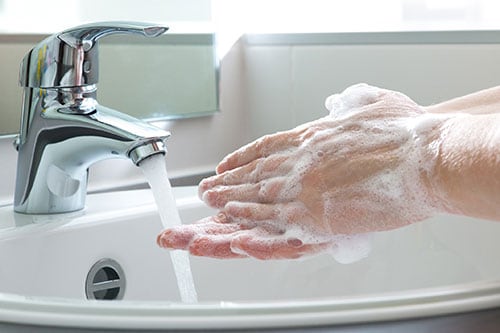 Washing hands with soap and water for at least 20 seconds.