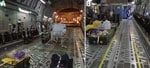 Thumbnail of Demarcation of clean and dirty zones during use of the Trexler Air Transportable Isolator patient transport system on a Lockheed Martin C-130 transport aircraft. A) Yellow lines clearly demarcate clean and dirty zones as required for transporting both confirmed and exposed viral hemorrhagic fever case-patients. B) For exposed patients, the demarcation zone should extend to a corridor leading to isolated toileting and comfort facilities.