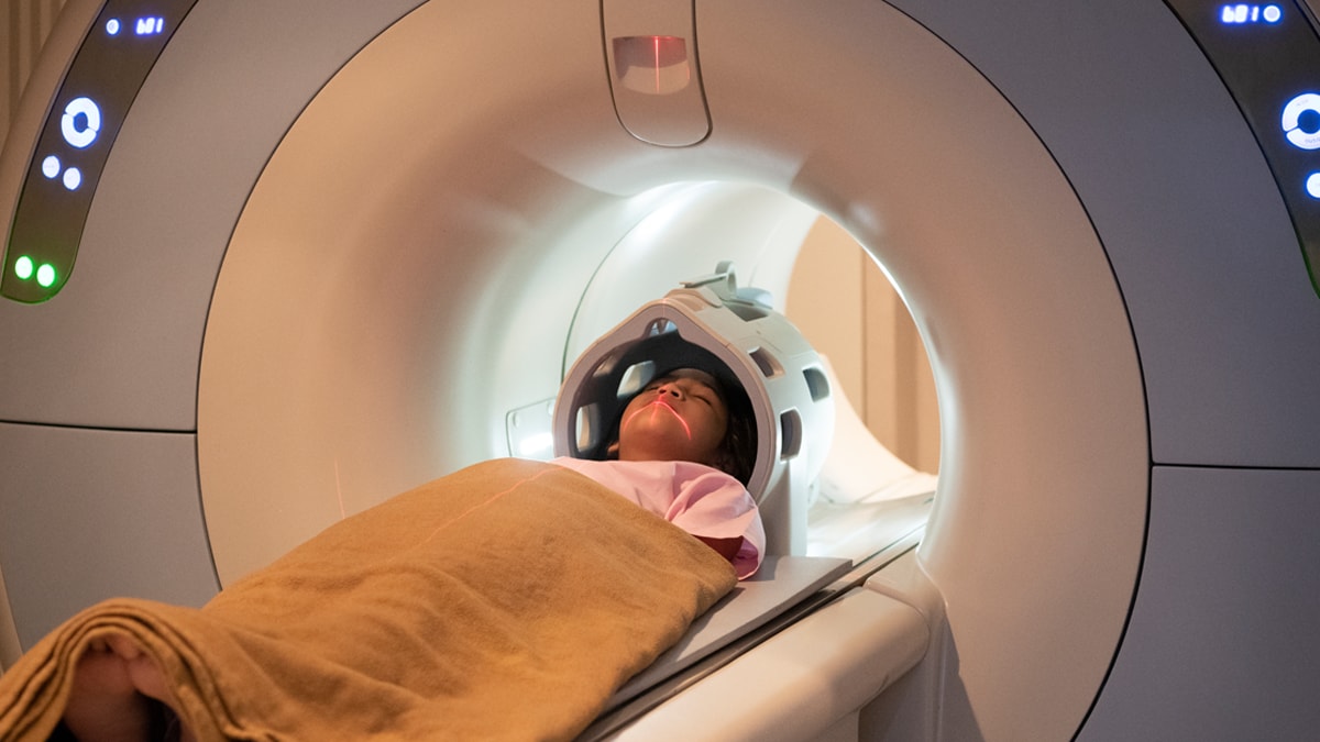 Child in medical scanning device