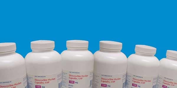 Bottles of doxycycline lined up beside each other