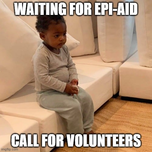 a small child sits on a sofa with hands folded in lap. Text reads: Waiting for Epi-Aid call for volunteers