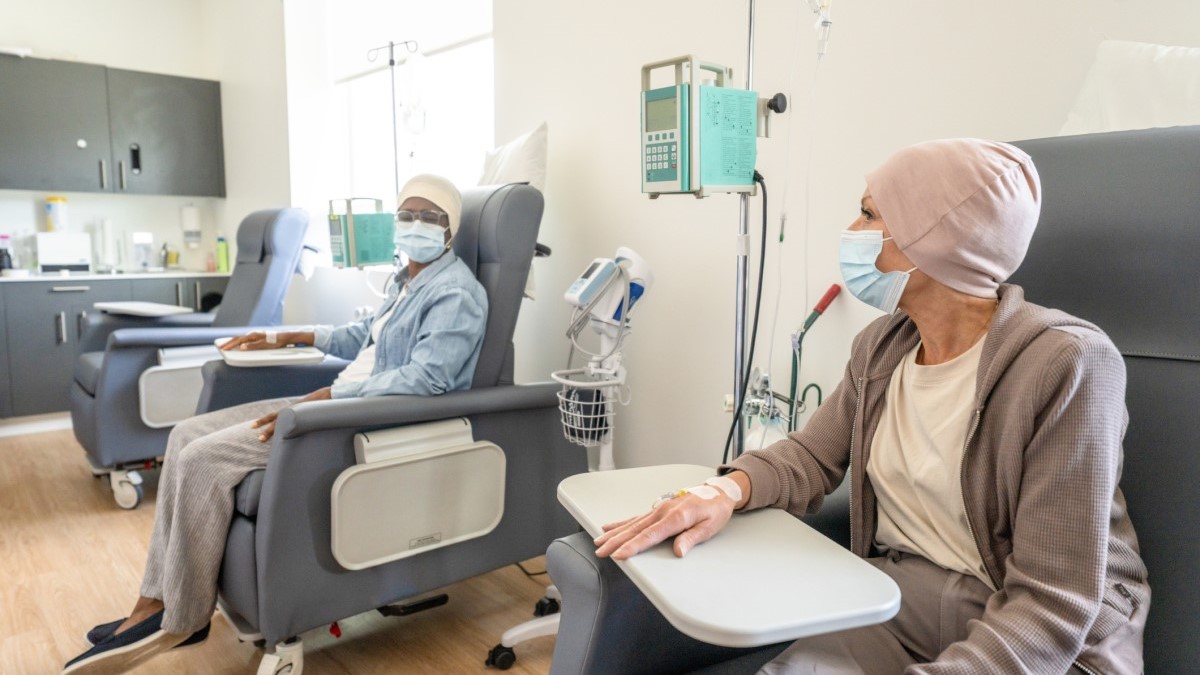 Photo of two women getting chemotherapy