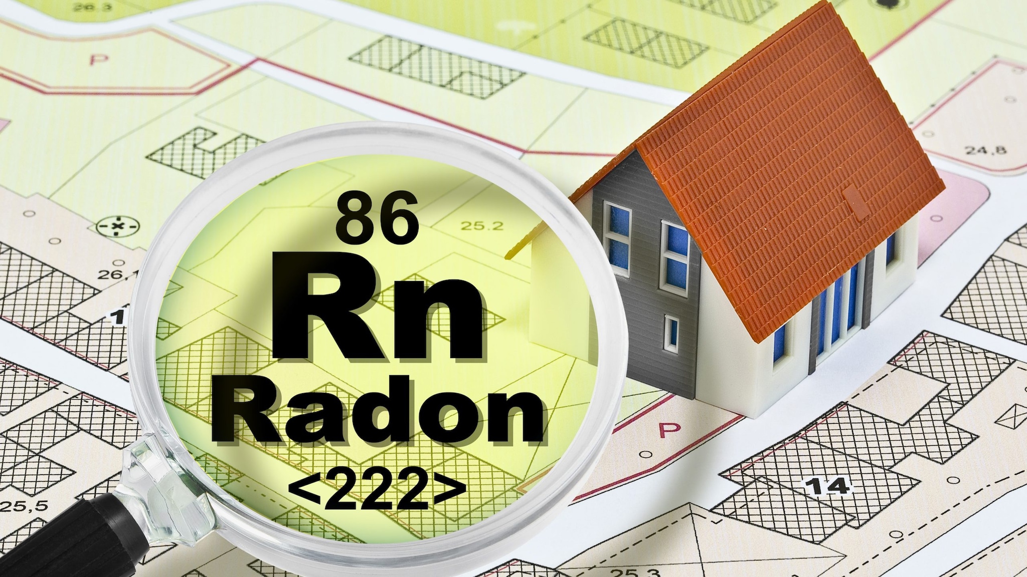 A gamepiece house sits on top of a neighborhood map. A magnifying glass hovers over the map with text in the lens that reads, "86 Rn Radon "