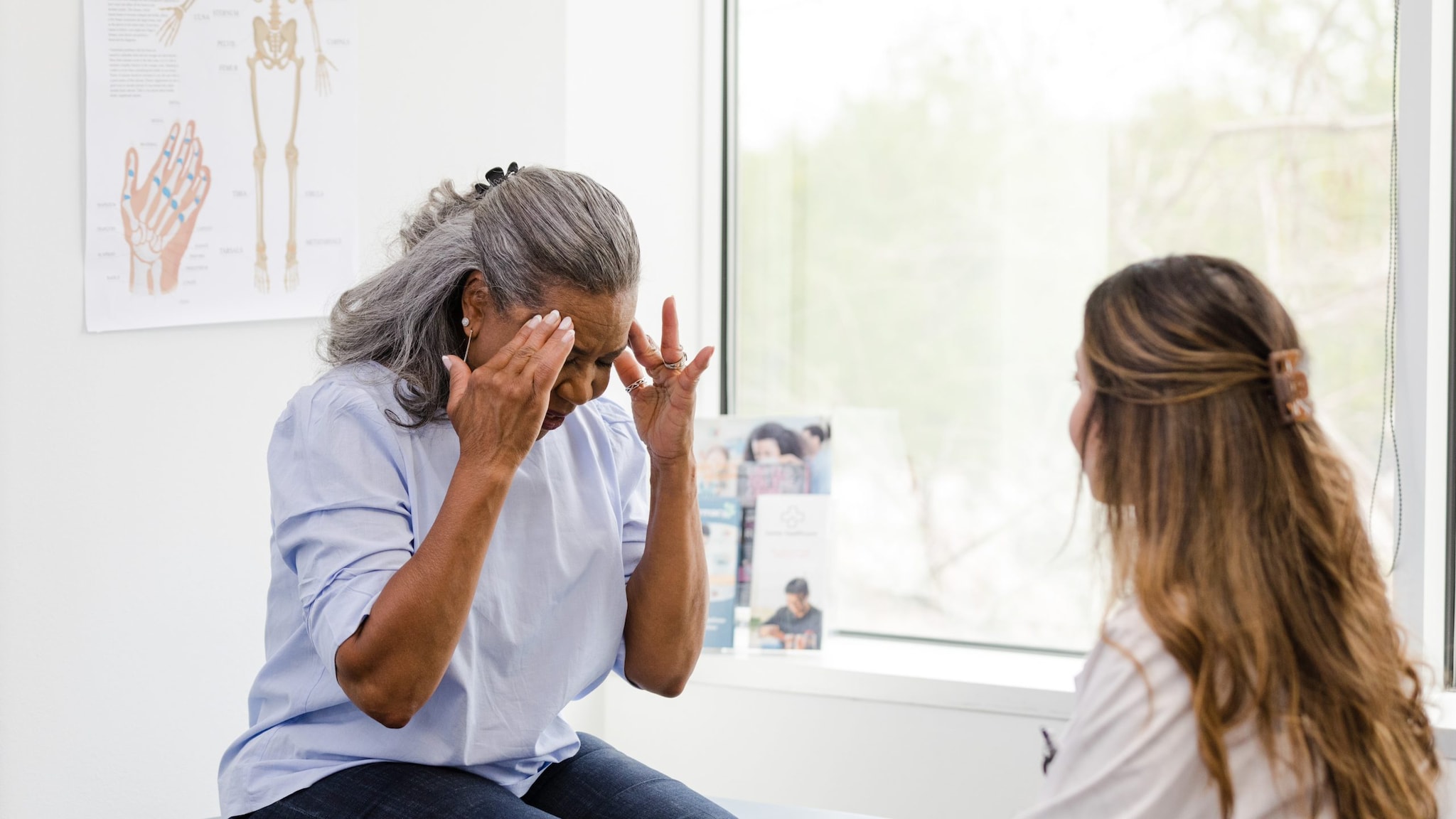 Patient with headache in doctors office