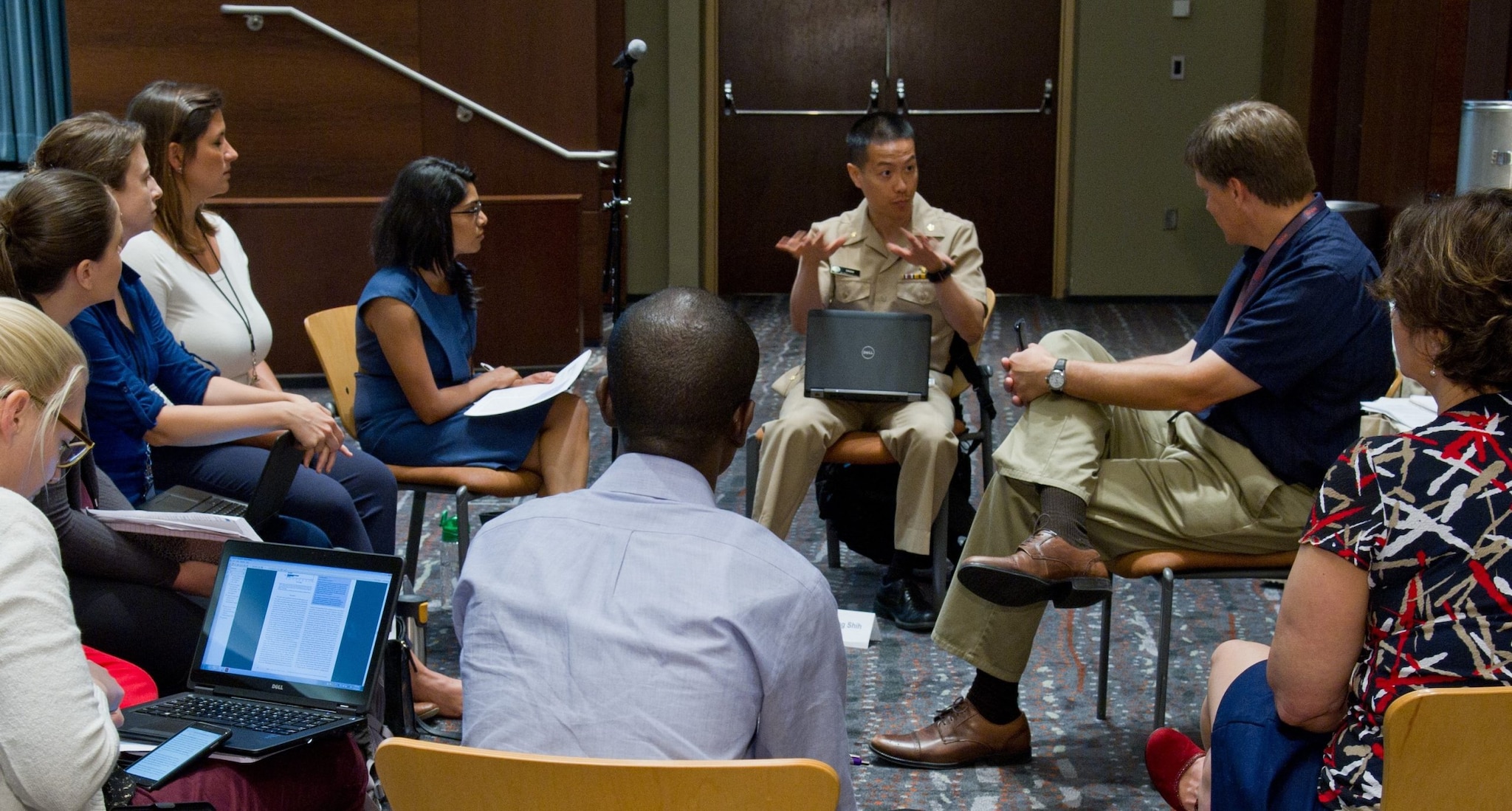 Epidemic Intelligence Service officers engage with CDC expert during media training.