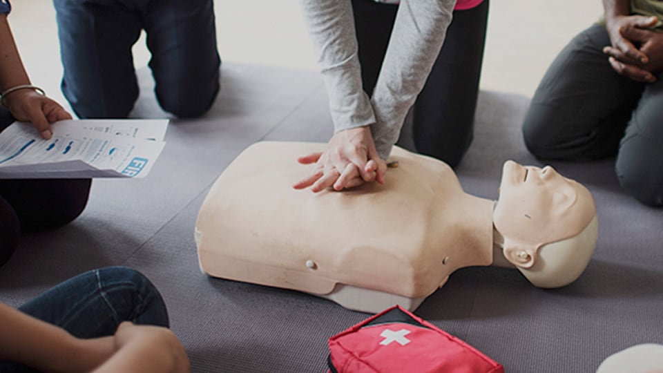 This image shows how an example of using a practical skill, like CPR, in an emergency.