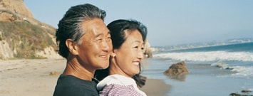Photo: A man and woman at the beach
