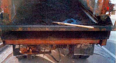 Cold patch in lead truck