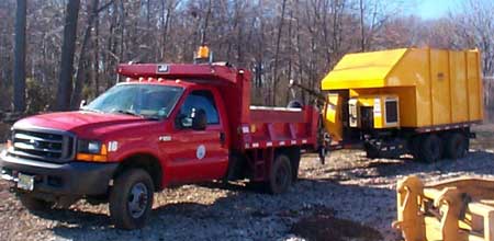 Photo 2. Identical leaf vacuum and pickup truck.