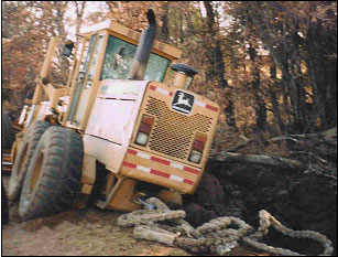 Figure 1. Grader stuck in Ditch