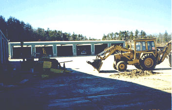 backhoe used to lift corn 
chopper head