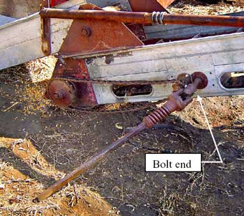 Photo 2– Close-up of the implement end of the PTO  driveline shaft showing the spring clutch and the  protruding bolt.