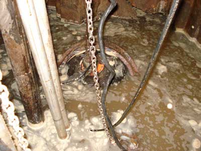 Pipe plug in broken sewer pipe at base of lift station