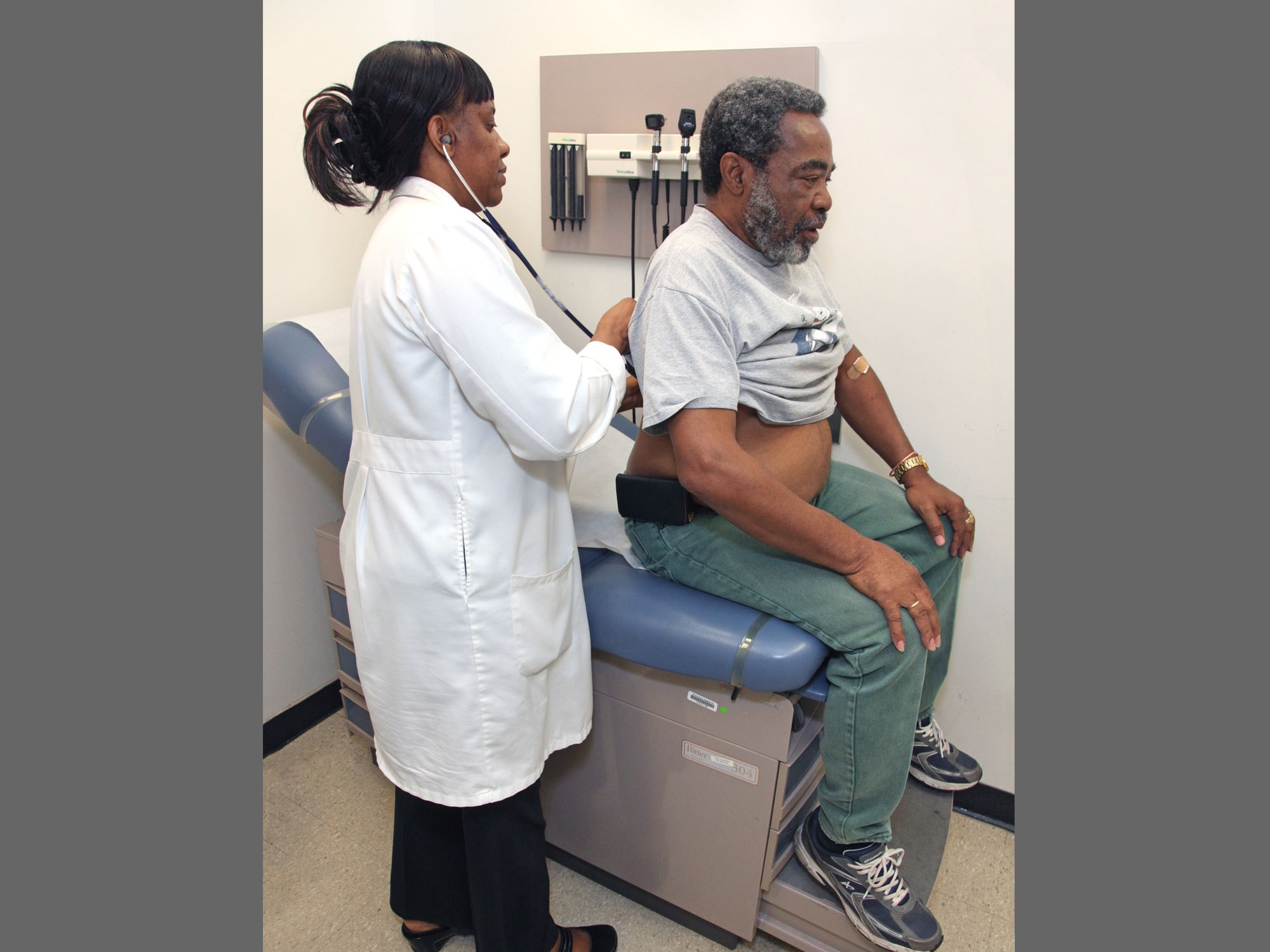 A health care provider examining a patient