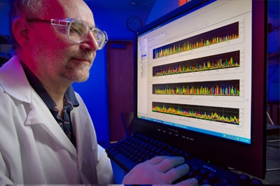 Scientist identifying pathogens on a computer screen.