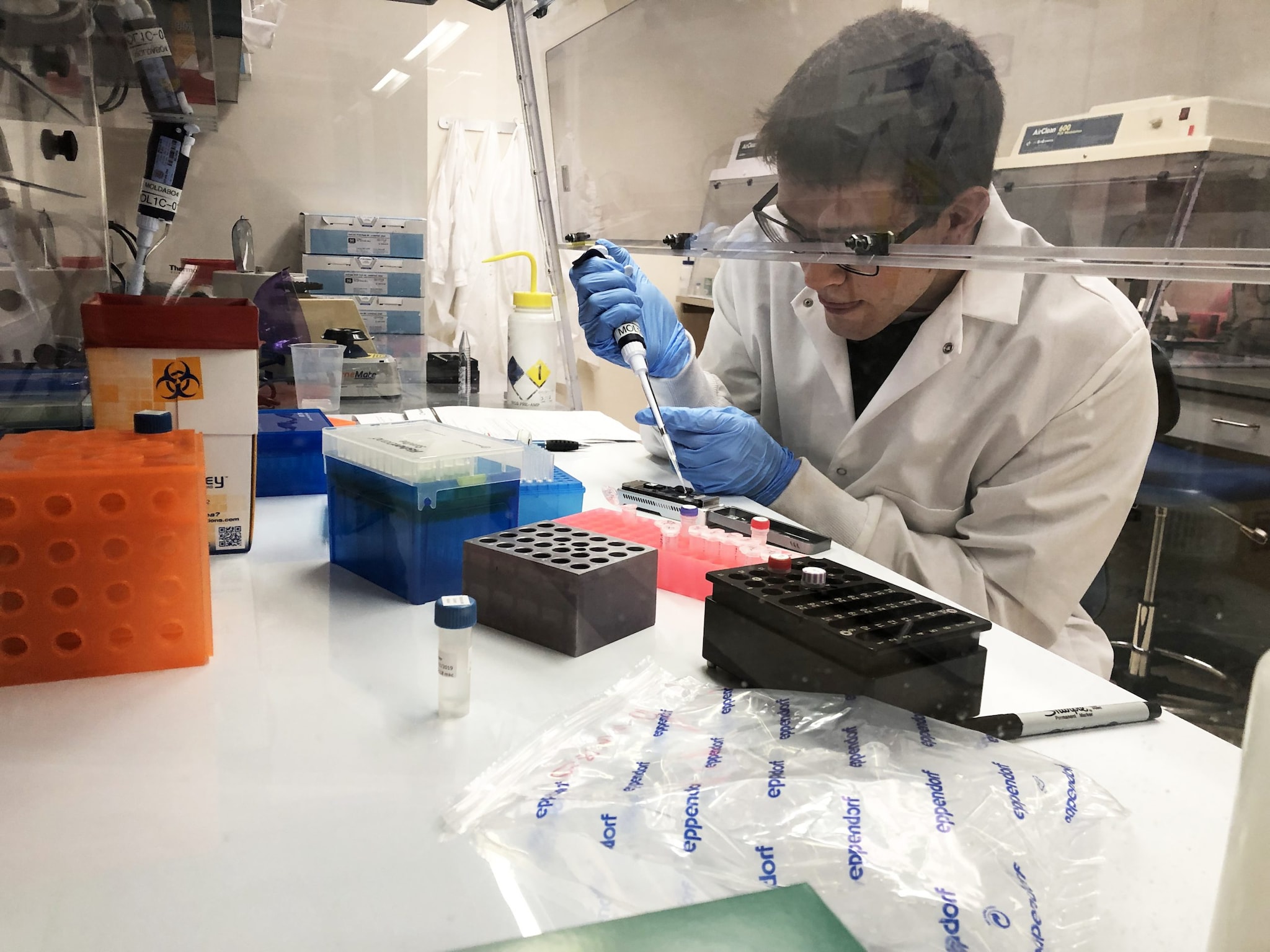 scientist using pipette in laboratory