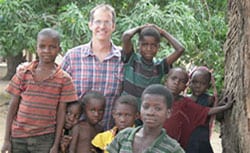 Epidemic Intelligence Service Officer Dr. Mark Lehman with children in eastern Zambia.