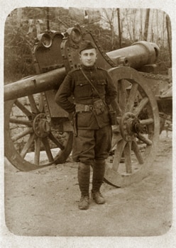 A soldier in uniform with a cannon.