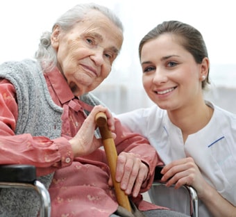 Photo: Nurse explaining to a nursing home resident about her antibiotic, how long it’s needed and possible side effects.