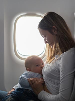 Breastfeeding mother on an airplane.