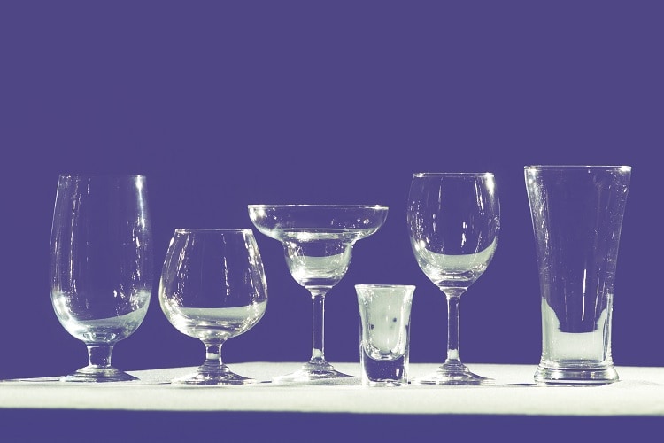 Photo of empty wine, shot, cocktail, and beer glasses