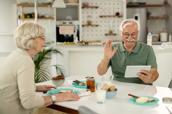 6 حقائق عن علاج السرطان بالطب البديل 16 Photo of a mature man making a video call over a digital tablet at home