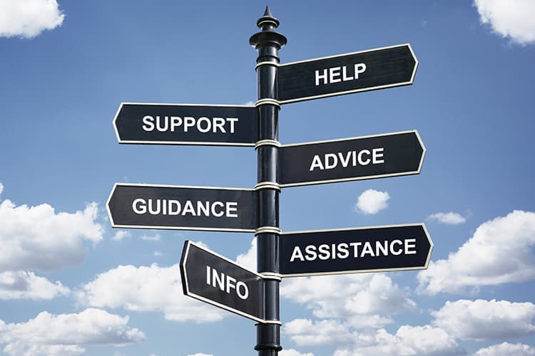 Help, support, advice, guidance, assistance and info crossroad signpost.