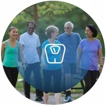 group of adults walking outside and scale icon