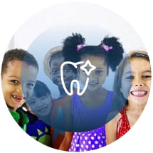 group of children sitting and smiling with tooth icon