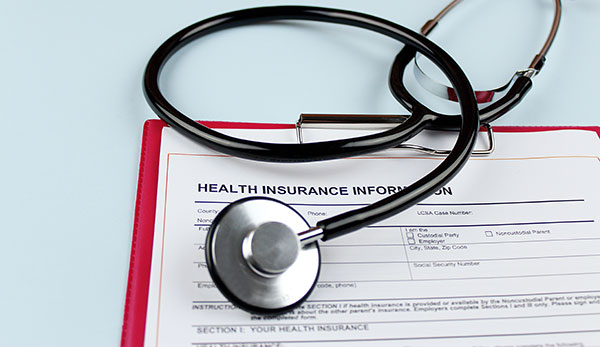 stethoscope and insurance form