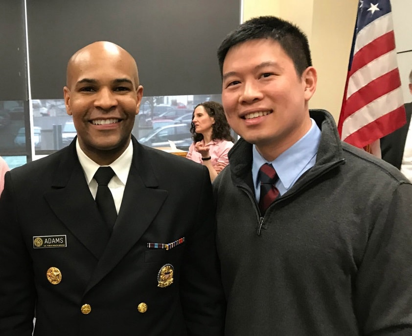 Alex Wu with U.S. Surgeon General Jerome M. Adams in 2019.