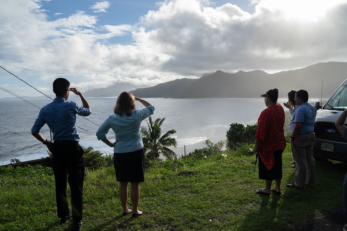 Howard Chiou with team in American Samoa overlooking ocean.