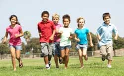 Group of young children running
