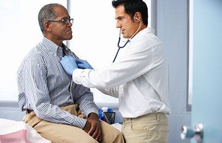 Doctor talking with mature man