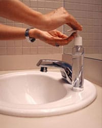Photo: Using hand sanitizer
