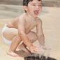 boy playing in splash pad