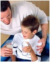 father and son drinking milk