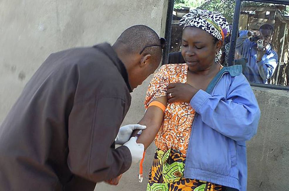 Tanzania FELTP resident Dr. Prosper Njau collecting a blood sample from a suspected brucellosis case in Kiteto District, Tanzania. Photo: Steve Wiersma