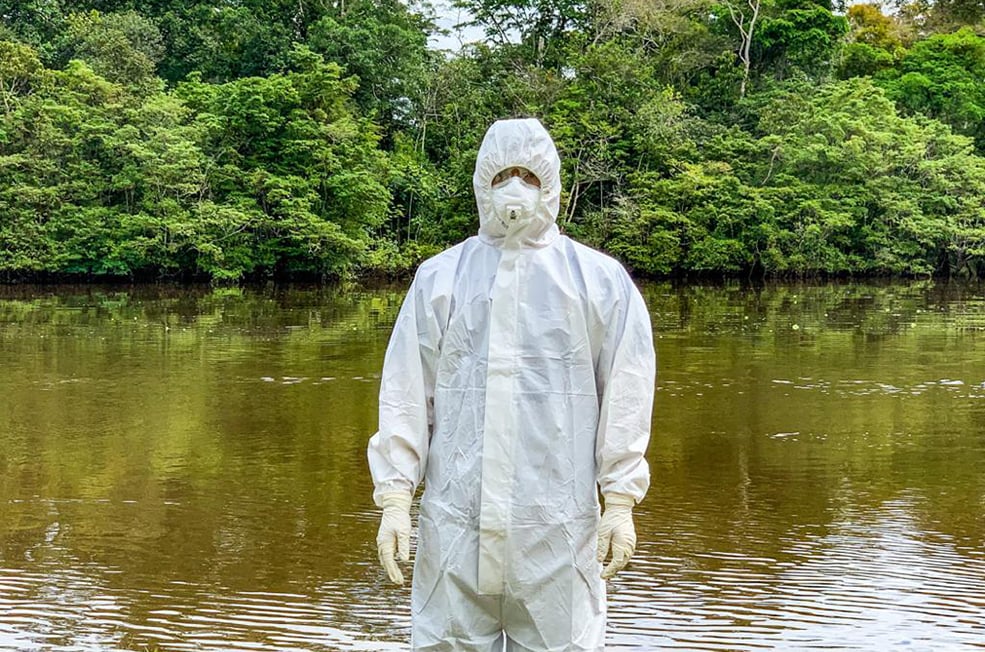 Colombia FETP resident wearing personal protective equipment (PPE) while investigating COVID-19 in the Amazonas state.