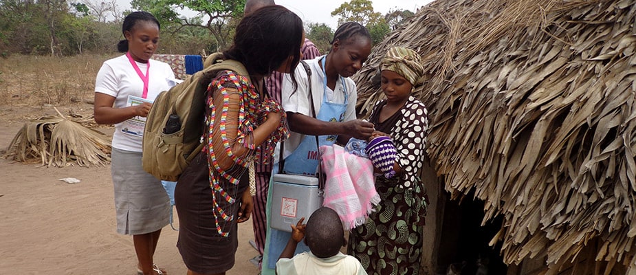 Giving an infant an oral vaccination in Nigeria.