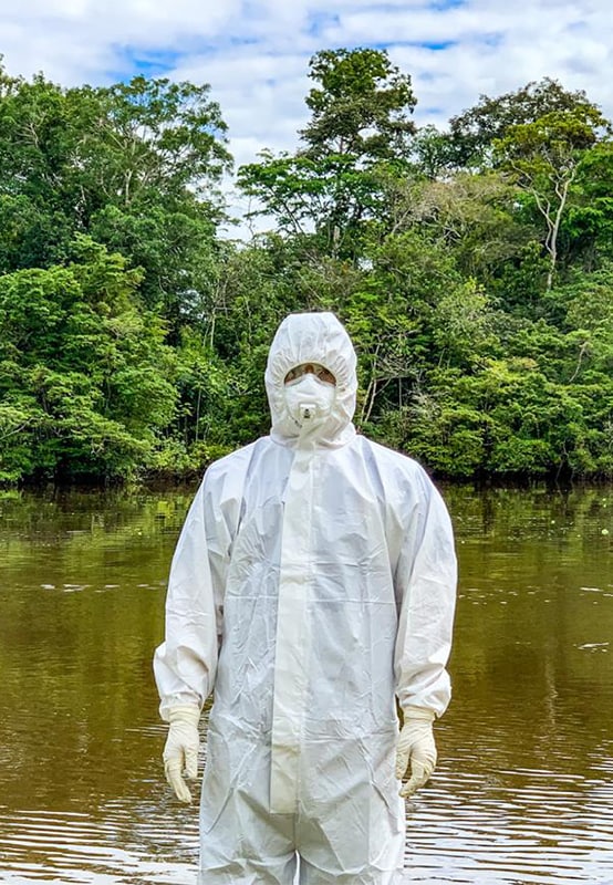 FETP resident wearing personal protective equipment (PPE) while investigating COVID-19 in the Amazonas state of Colombia.