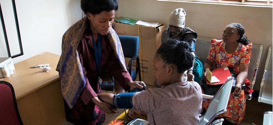 A woman in a Malawi clinic has her blood pressure measured. High blood pressure is the leading controllable risk factor for heart disease and stroke.