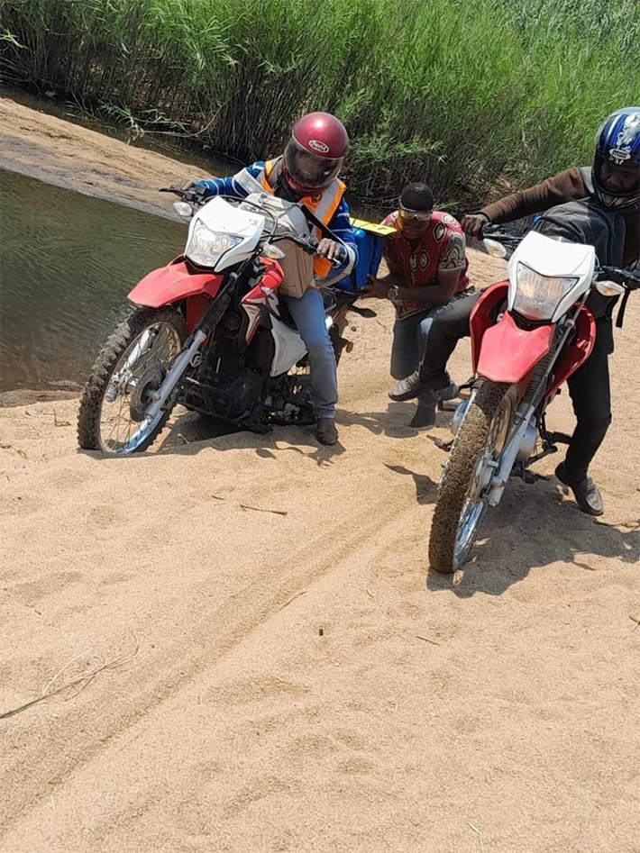 Motorcycles carrying coolers of polio vaccines in Mozambique
