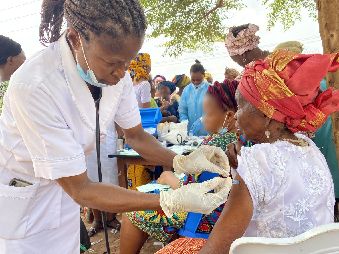 A community member receives her COVID-19 vaccine as part of an outreach campaign in Abia State, Nigeria.