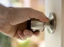 Photo of hand on door knob