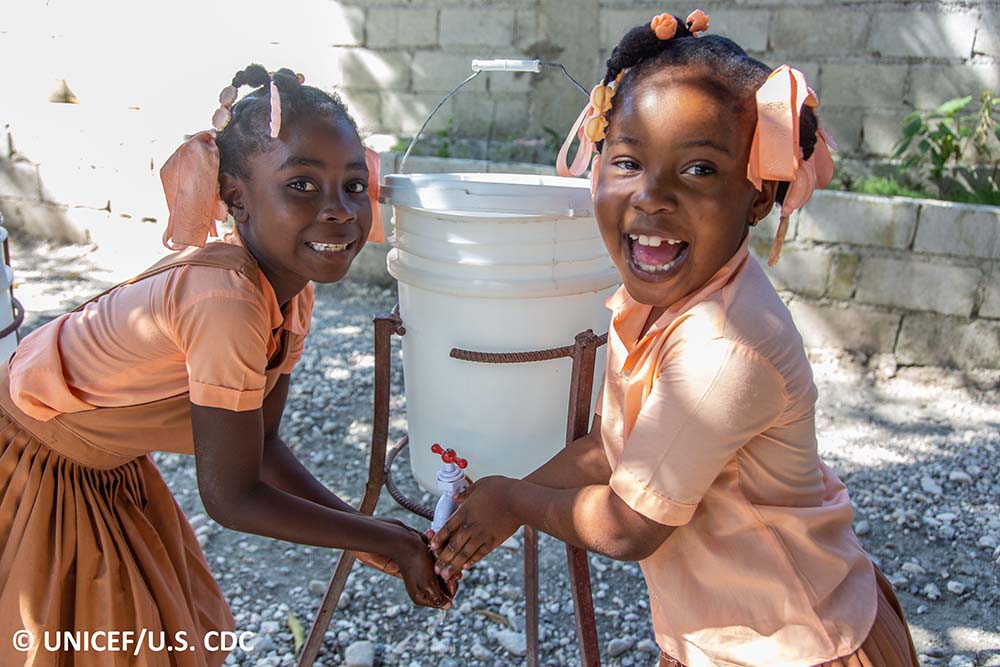 Schoolgirls washing their hands
