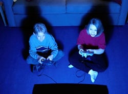 photo of two children playing a video game