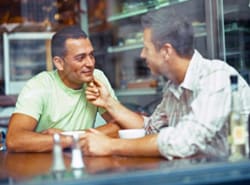 two men in a cafe