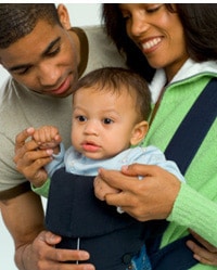 Young African American couple with baby.
