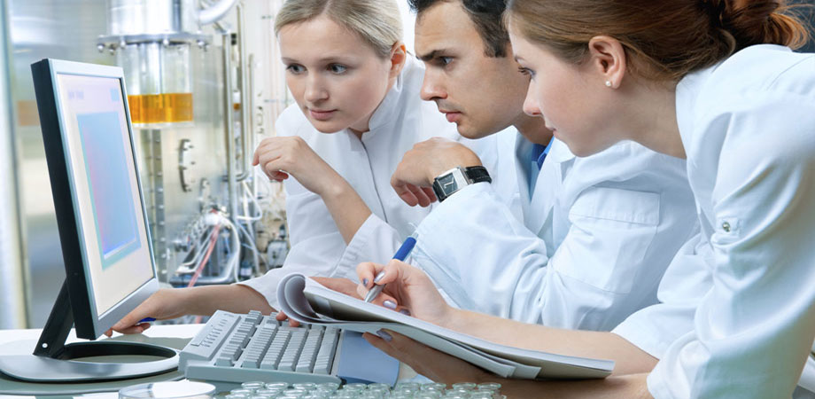 Images of workers in a lab. 